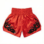 Red shorts with black tribal designs on a white background