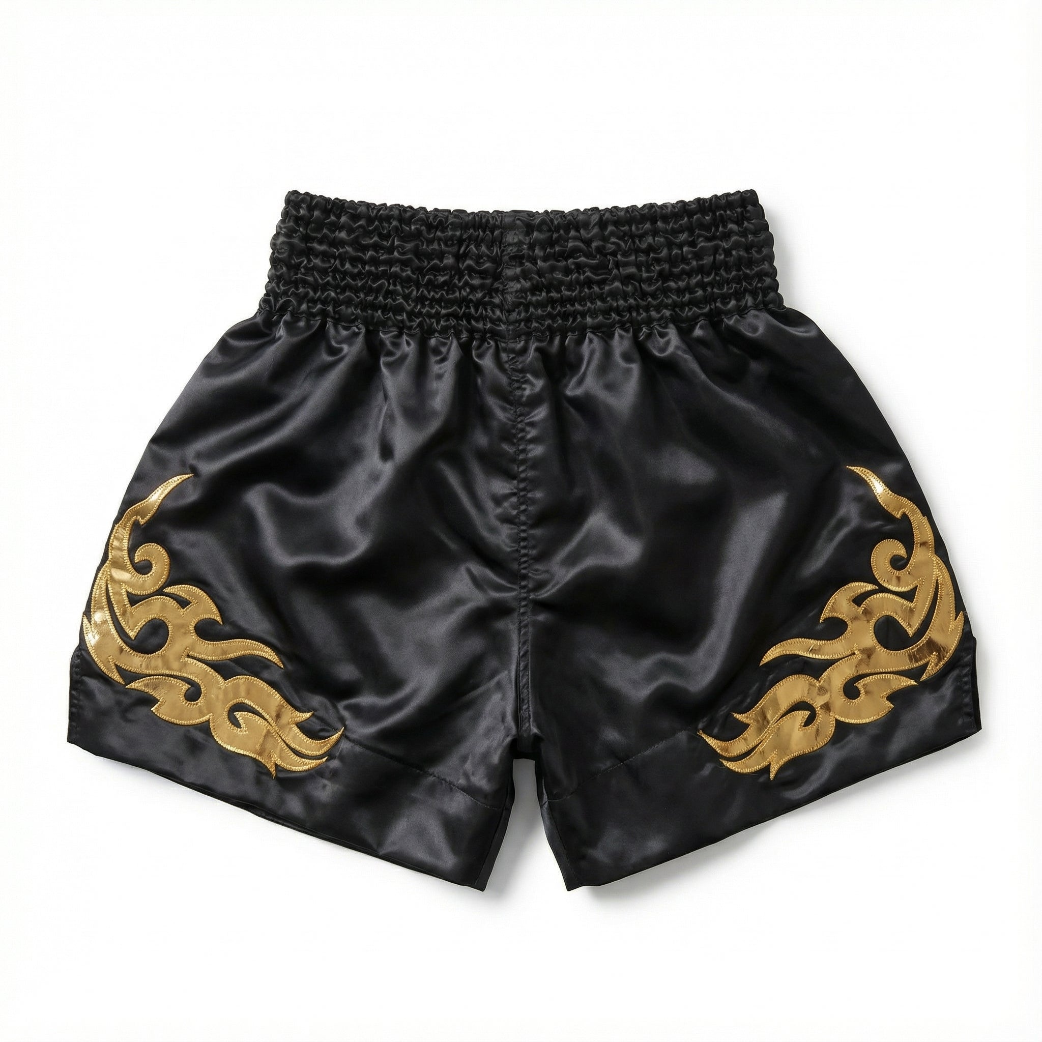 Black shorts with gold flame designs on a white background