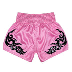 Pink shorts with black tribal designs on a white background