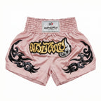 Pink Muay Thai shorts with black designs and a visible brand label on a white background